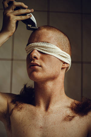 Blindfolded Man Gets Bald Haircut Wallpaper