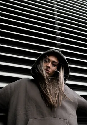 Blonde Girl Wearing Hoodie Wallpaper