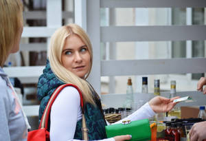 Blonde Italian Girl Paying Bill Wallpaper