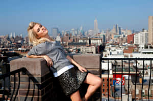 Blonde Woman Overlooking City Skyline Wallpaper