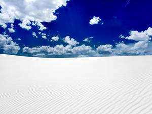 Blue And White Day In The Desert Wallpaper