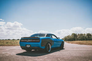 Blue Dodge Challenger Parked Outdoors Wallpaper