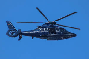 Blue Helicopter Flying Wallpaper