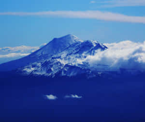 Blue Mountain With Clouds At Peak Wallpaper