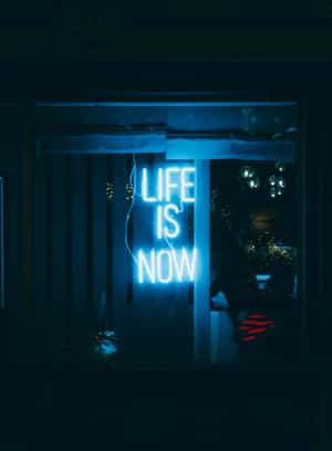 Blue Neon Life Is Now Sign Wallpaper