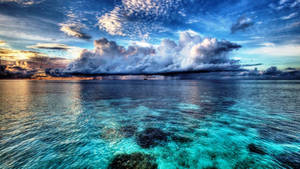 Blue Ocean With Thick Clouds Wallpaper