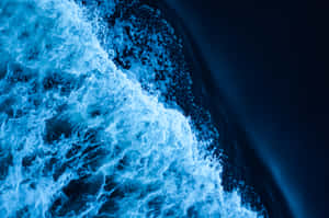 Blue Water Crashing On The Ocean Wallpaper