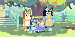 Bluey Family In Front Of House Wallpaper