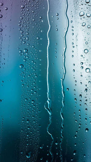 Bluish Themed Glass Pane Raindrops Wallpaper