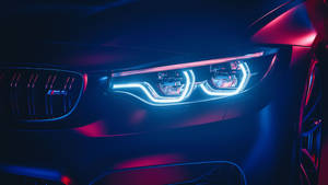 Bmw M4 Headlights In The Dark Wallpaper