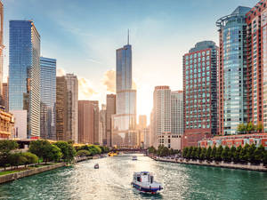 Boat Cruising On Chicago River In Illinois Wallpaper