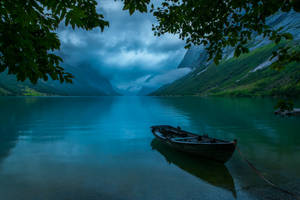 Boat On A Dark Lake Wallpaper