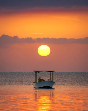 Boat With A Sun In The Horizon Wallpaper