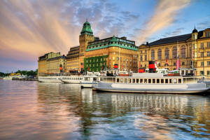 Boats Docked On Stockholm Waterfront Wallpaper