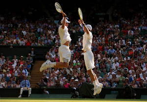 Bob Bryan Jumping With Mike Bryan Wallpaper