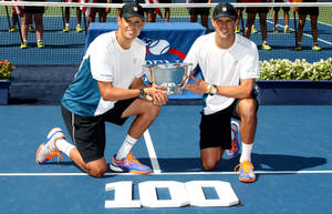 Bob Bryan Showcasing Championship Trophy Wallpaper