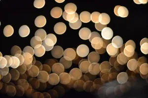 Bokeh Gold Glitter Black Background Wallpaper