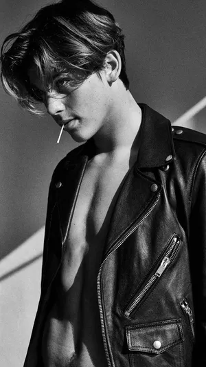 Bold And Edgy - Portrait Of A Bad Boy With Leather Jacket Wallpaper