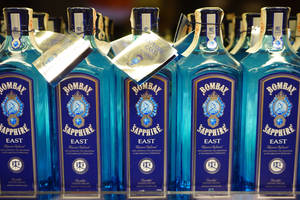 Bombay Bottles On Store Rack Wallpaper