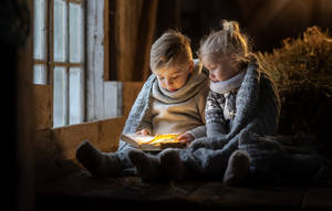 Boy And Girl Reading Book Wallpaper