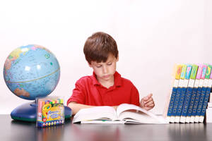 Boy In Red Shirt Learning Wallpaper