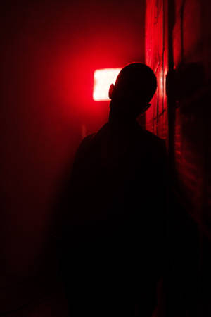 Boy Shadow Against Red Light Wallpaper