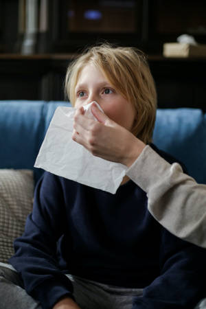 Boy Sneeze Onto A Napkin Wallpaper