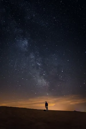 Boy Under Galaxy Sky Wallpaper