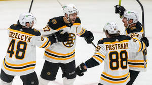 Brad Marchand Celebrating With Teammates Wallpaper