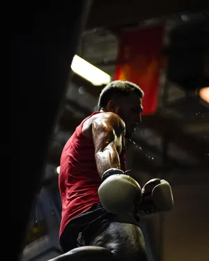 Brad Tavares Wearing Boxing Gloves Wallpaper