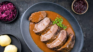 Braised Sauerbraten Traditional German Dish With Creamy Sauce Wallpaper