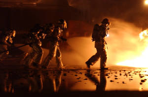 Brave Firefighters Marching Towards Danger Wallpaper