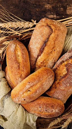 Various of breads on the wooden table background. Food and bakery concept.  Full of breads theme. Generative AI 23892788 Stock Photo at Vecteezy