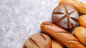 Breads On Cemented Table Wallpaper