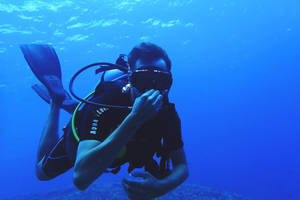 Breath-taking Scuba Diving Adventure Under The Deep Blue Oceans Wallpaper