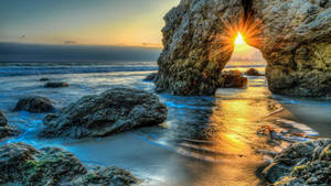 Breathtaking Malibu Beach Rock Formations Wallpaper