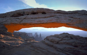 Breathtaking Sunrise At Mesa Arch In Canyonlands National Park Wallpaper