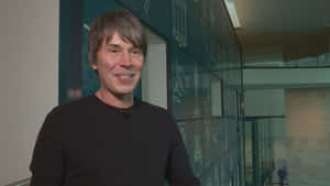 Brian Cox Smiling Interview Setting Wallpaper