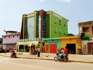 Bright And Vibrant Liberia: A Kaleidoscope Of Colors Wallpaper