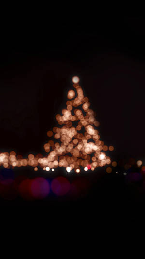 Bright Christmas Lights Adorn The Night Wallpaper