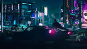 Bright Neon Lights Illuminate The Night Sky Over The Electrifying Times Square. Wallpaper