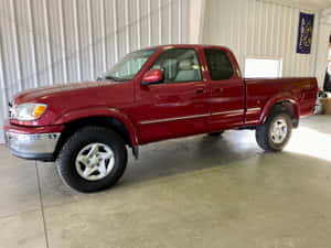 Bright Red Tundra In A Modern Garage Wallpaper