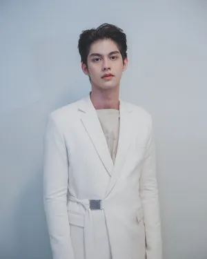 Bright Vachirawit In A White Suit Wallpaper