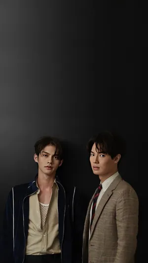 Brightwin Duo Dressed In Formal Attire Wallpaper