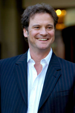 British Actor Colin Firth In A Candid Moment Wallpaper