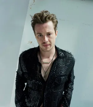 British Actor Joseph Quinn Showcasing His Style In A Stud-embellished Shirt Wallpaper