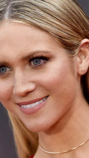 Brittany Snow Smiling Radiantly In A Photo Shoot Wallpaper