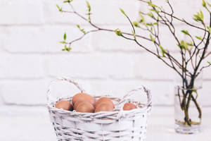 Brown Easter Eggs On Basket Wallpaper