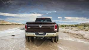 Brown Lifted Truck On Muddy Area Wallpaper