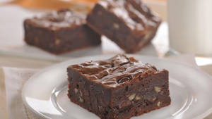 Brownies With Chocolate And Nuts Wallpaper